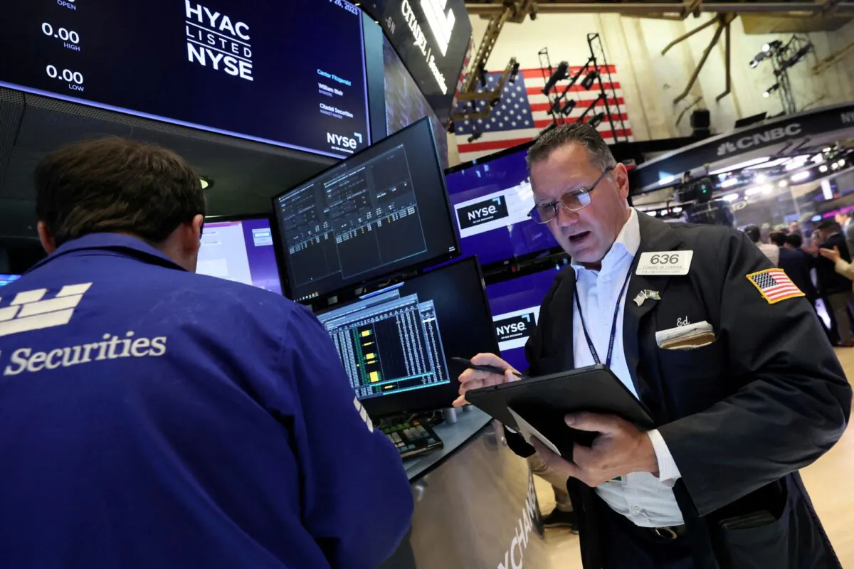 Traders work on the floor of the New York Stock Exchange (NYSE) in New York City on July 26, 2023. (Brendan McDermid/Reuters)