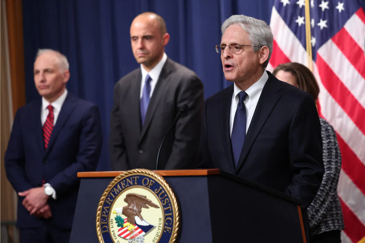 U.S. Attorney General Merrick Garland speaks, as officials including U.S. Attorney for the District of Columbia Matthew Graves (center), listen, in Washington on May 4, 2023. (Win McNamee/Getty Images)