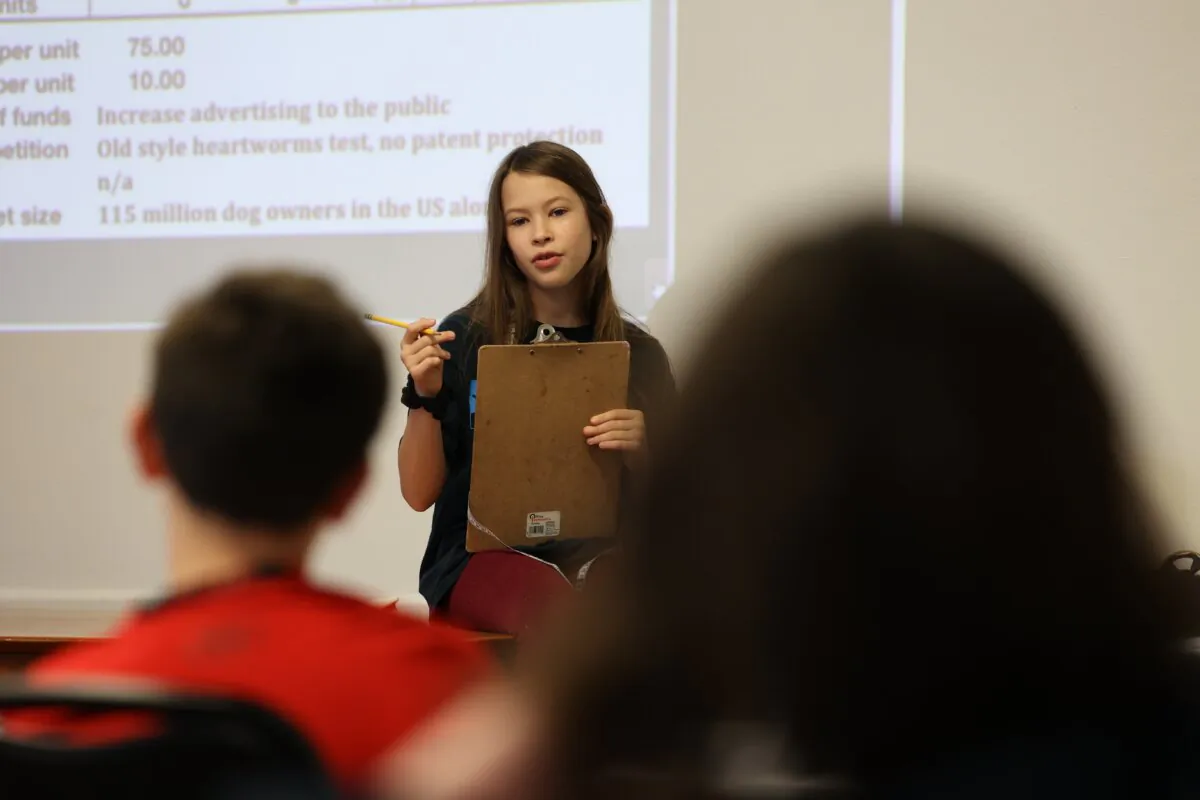 A Middle School MBA student pitches a company to her classmates. (Photo by Michael Franco)