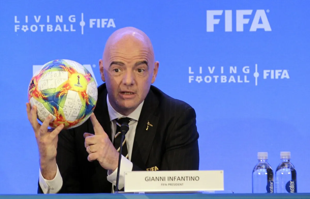 FIFA President Gianni Infantino holds a soccer ball as he speaks during a press conference after the FIFA Council Meeting in Miami on March 15, 2019. (Luis M. Alvarez/AP Photo)