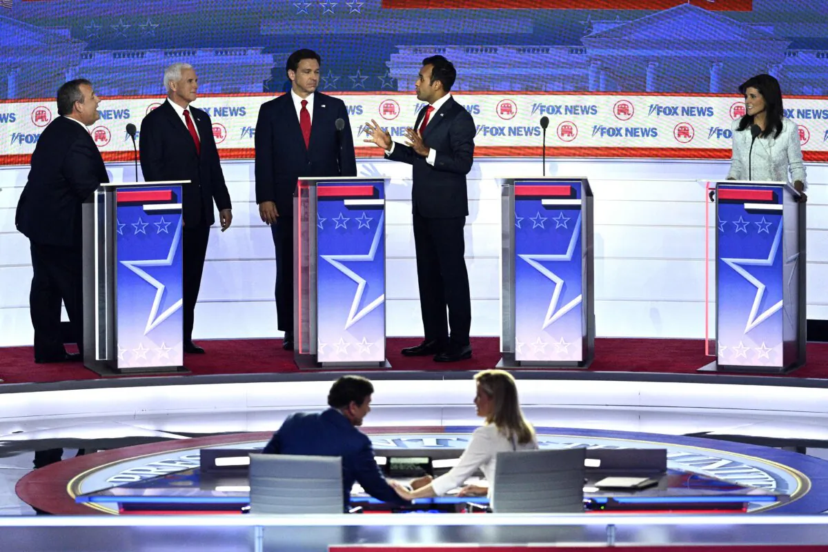 Former U.N. ambassador Nikki Haley (R) looks on as former New Jersey Gov. Chris Christie (L), former Vice President Mike Pence (2nd L), Florida Gov. Ron DeSantis (C) and entrepreneur Vivek Ramaswamy (2nd R) during a break in the first Republican Presidential primary debate in Milwaukee, Wis., on Aug. 23, 2023. (Brendan Smialowski/AFP via Getty Images)