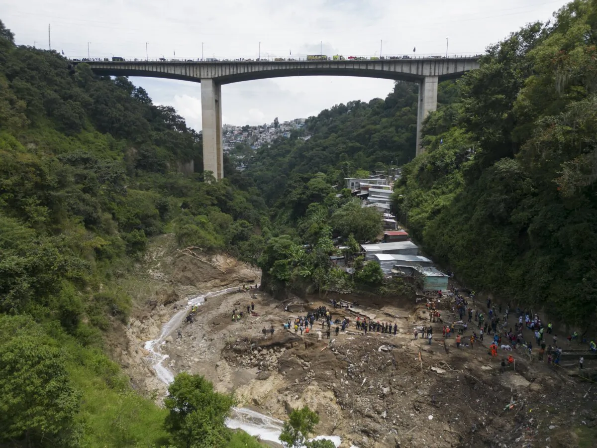 The Naranjo River moves through the "Dios es fiel," or "God is Loyal" shanty on the outskirts of Guatemala City on Sept. 25, 2023, the day after homes were swept away overnight after heavy rain. (Moises Castillo/AP Photo)