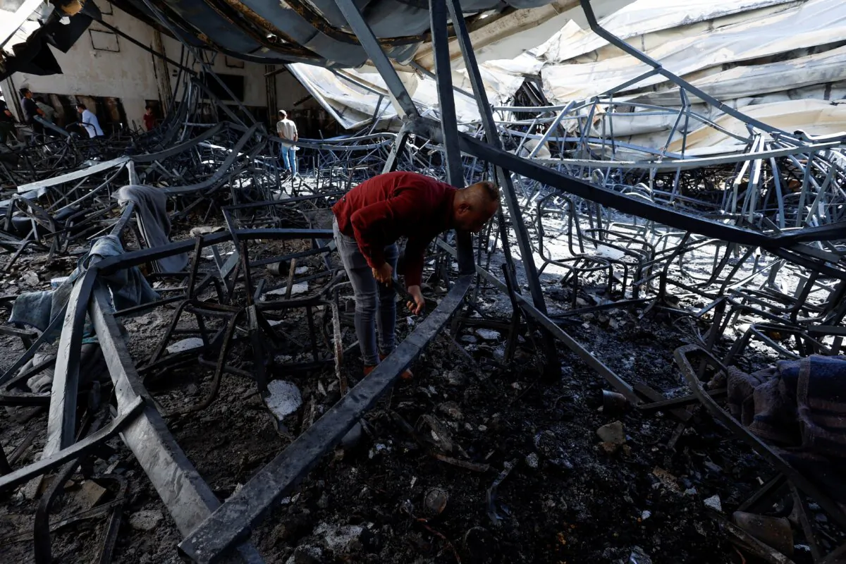 People gather at the site following a fatal fire at a wedding celebration, in the district of Hamdaniya in Iraq's Nineveh Province, Iraq, on Sept. 27, 2023. (Khalid Al-Mousily/Reuters)