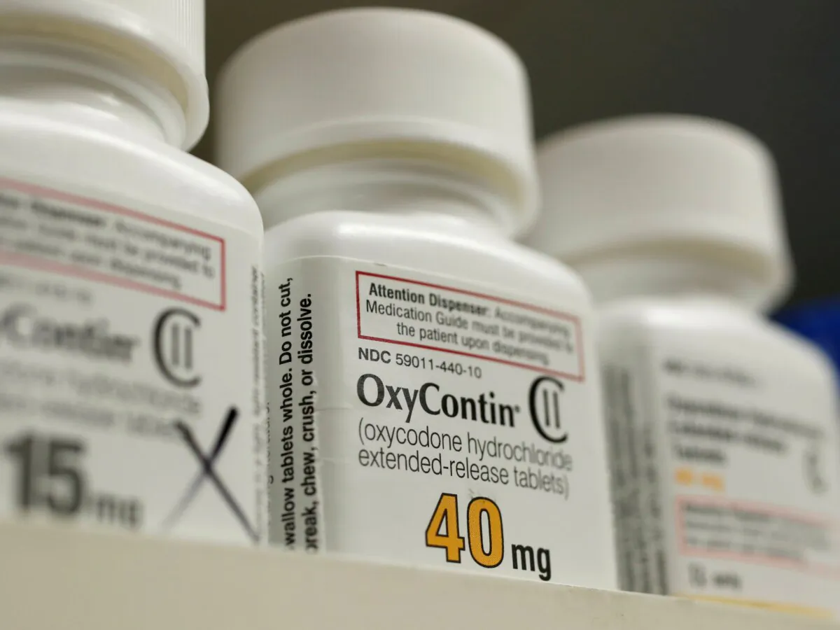 Bottles of prescription painkiller OxyContin made by Purdue Pharma LP sit on a shelf at a local pharmacy in Provo, Utah, on April 25, 2017. (George Frey/Reuters)