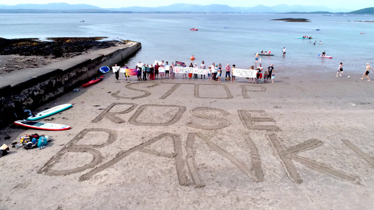Campaigners from Time for Change Argyll and Bute taking part in a protest against the Rosebank oilfield in Oban, Scotland, on June 10, 2023. (PA)