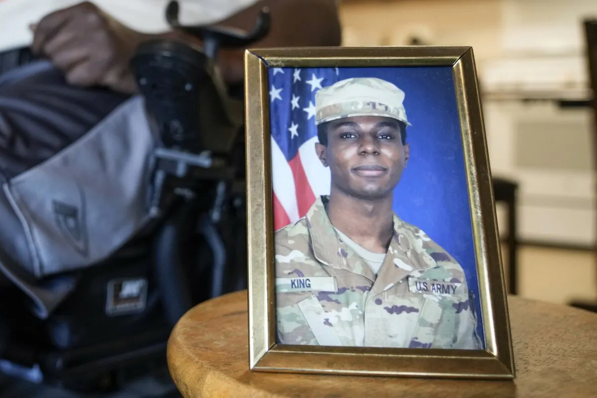 A portrait of U.S. Army Pvt. Travis King is displayed as his grandfather, Carl Gates, talks about his grandson, in Kenosha, Wis., on July 19, 2023. (Morry Gash/AP Photo)