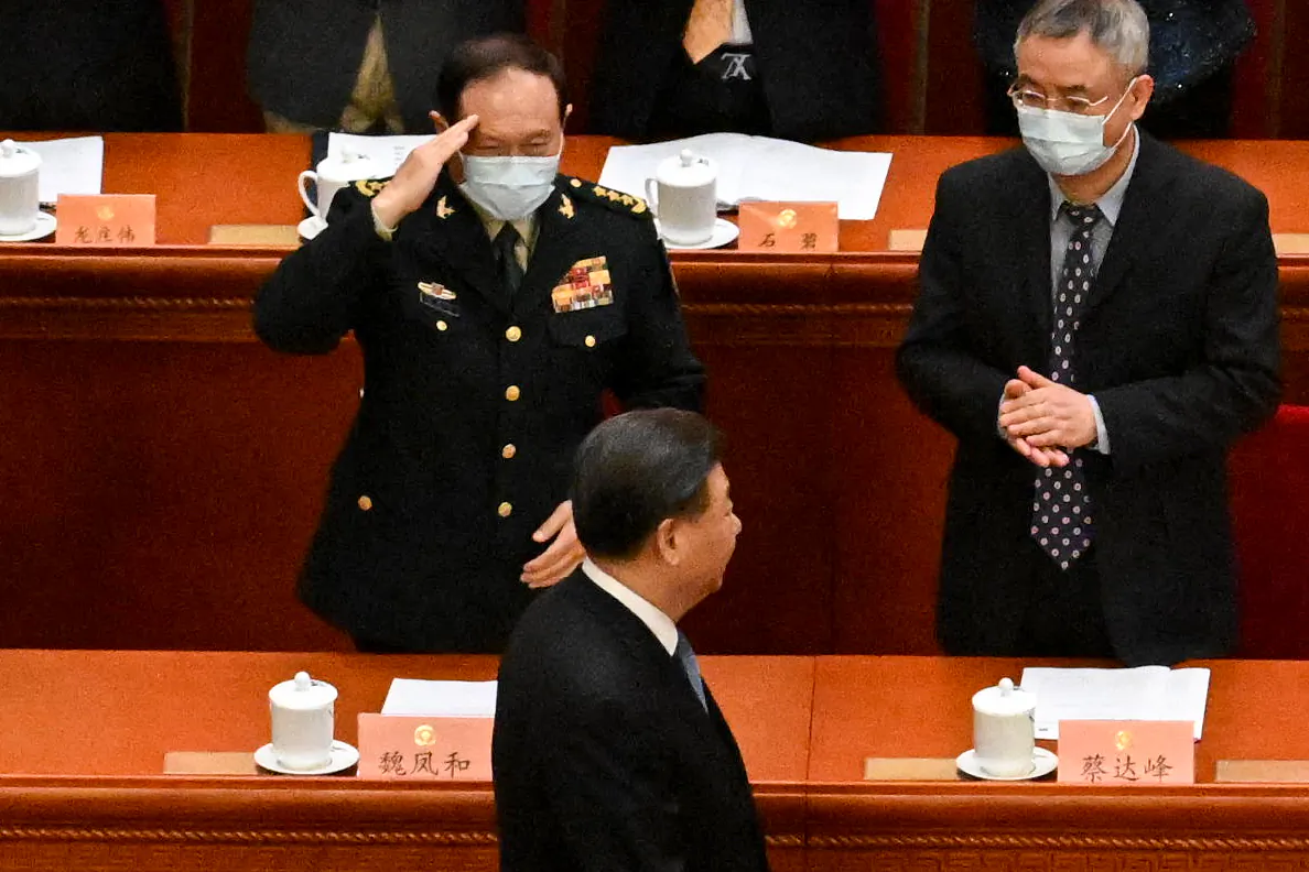 China's Defence Minister Wei Fenghe (top L) salutes as China's President Xi Jinping (bottom) arrives for the opening ceremony of the Chinese People's Political Consultative Conference (CPPCC) at the Great Hall of the People in Beijing on March 4, 2023. (NOEL CELIS/AFP via Getty Images)