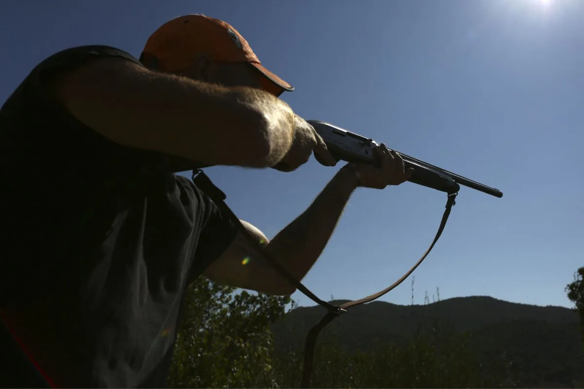 A hunter aims with his rifle in this file photo taken in 2021. (Pascal Pochard-Casabianca/AFP via Getty Images)