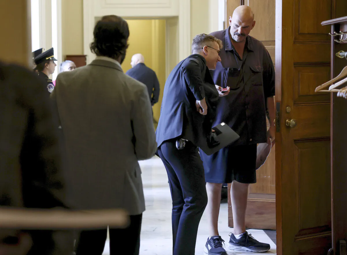 Sen. John Fetterman (D-Pa.) (right) arrives to a weekly Senate Democratic policy luncheon meeting at the U.S. Capitol Building in Washington on Sept. 19, 2023. (Anna Moneymaker/Getty Images)