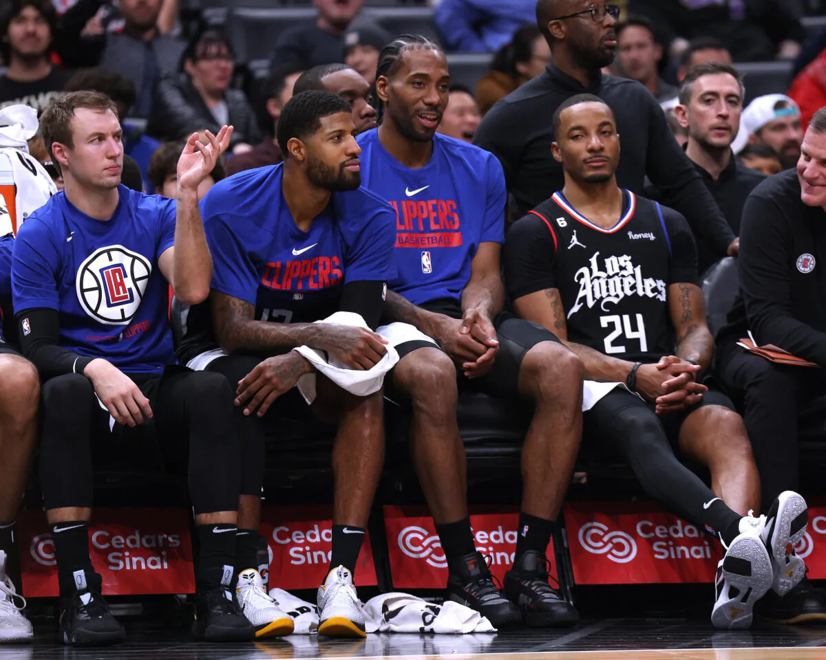 Kawhi Leonard (2) of the LA Clippers laughs on the bench with Paul George (13) during a Clippers win over the San Antonio Spurs in Los Angeles on January 26, 2023. (Harry How/Getty Images)