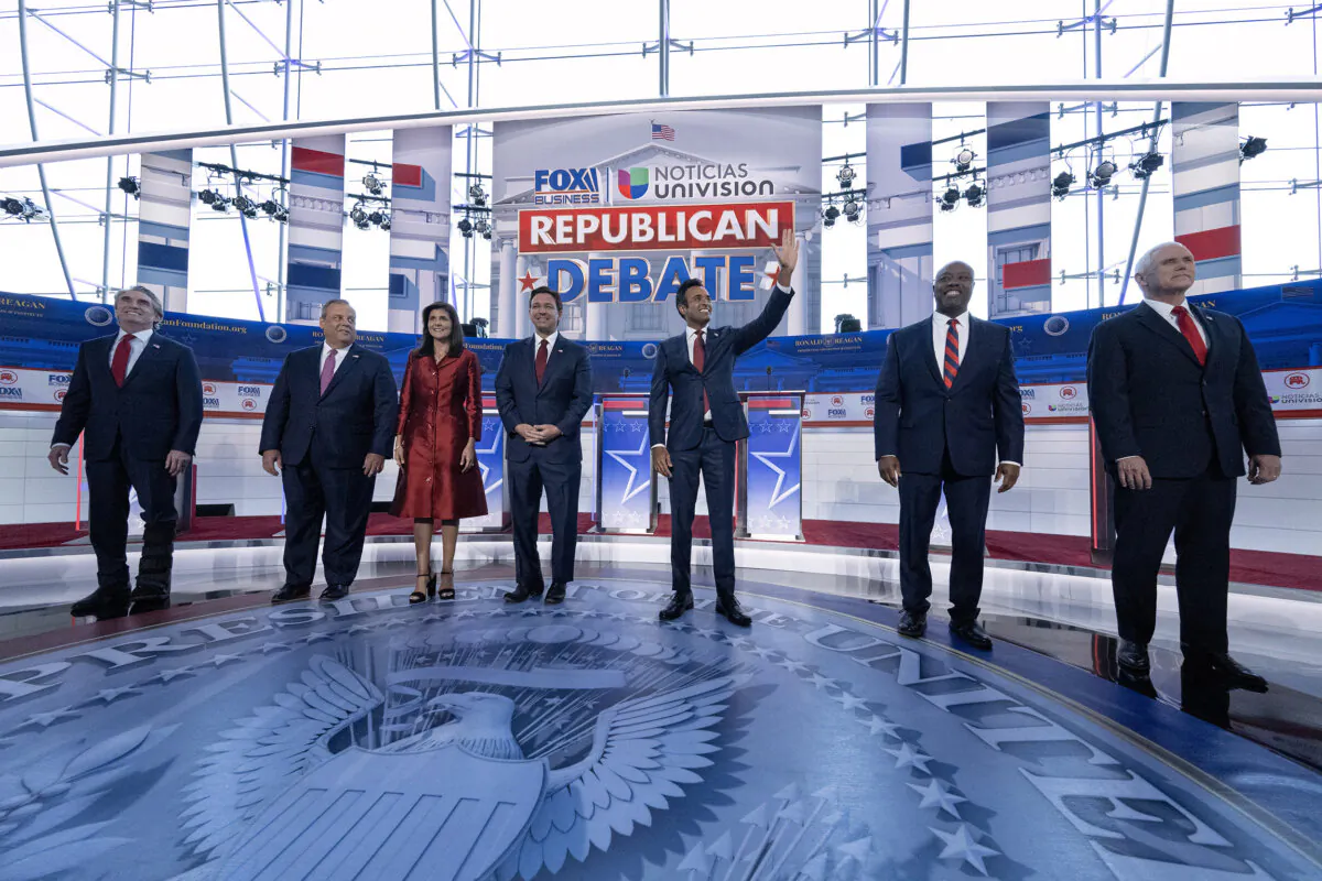 (L–R) North Dakota Gov. Doug Burgum, former New Jersey Gov. Chris Christie, former U.N. Ambassador Nikki Haley, Florida Gov. Ron DeSantis, entrepreneur Vivek Ramaswamy, Sen. Tim Scott (R-S.C.), and former Vice President Mike Pence at the second Republican presidential primary debate at the Ronald Reagan Presidential Library in Simi Valley, Calif., on Sept. 27, 2023. (Pedro Ugarte/AFP via Getty Images)