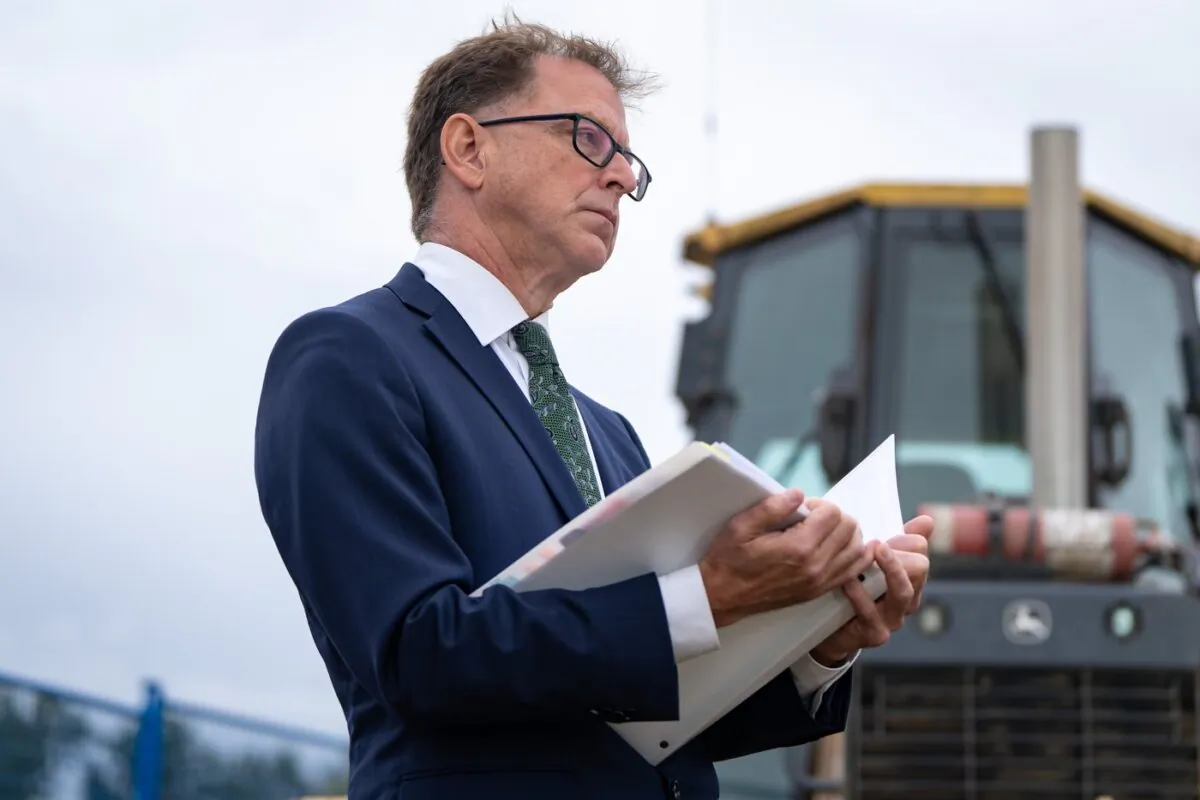 British Columbia Health Minister Adrian Dix stands at an announcement for a new hospital in Surrey, B.C., on Sept. 12, 2023. (The Canadian Press/Ethan Cairns)