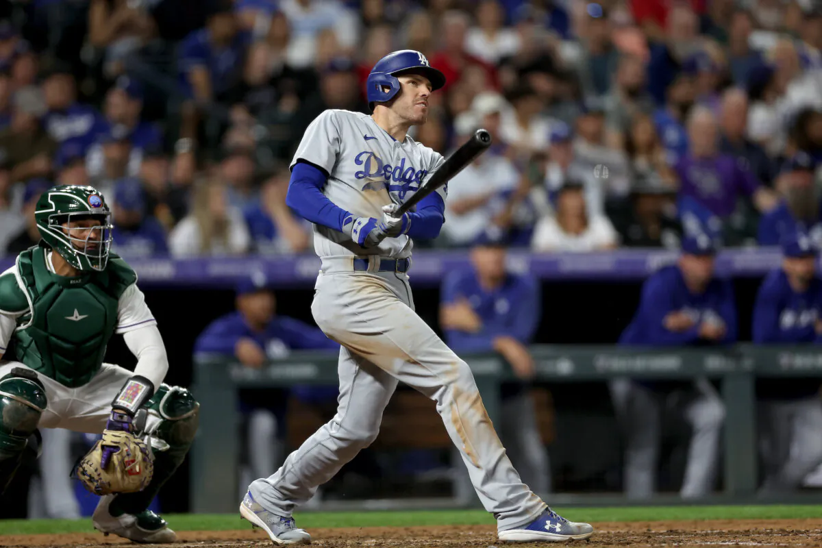 Freddie Freeman (5) of the Los Angeles Dodgers hits a 3 RBI home run against the Colorado Rockies in the eighth inning at Coors Field in Denver on Sept. 27, 2023. (Matthew Stockman/Getty Images)
