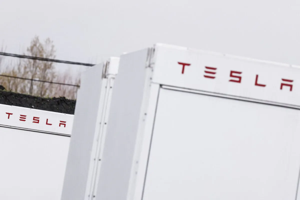 This photograph taken shows the Telsa logo on a battery at the largest electricity storage plant in Les Deux-Acren, Belgium, on Dec. 1, 2022.(Kenzo Tribouillard/AFP via Getty Images)
