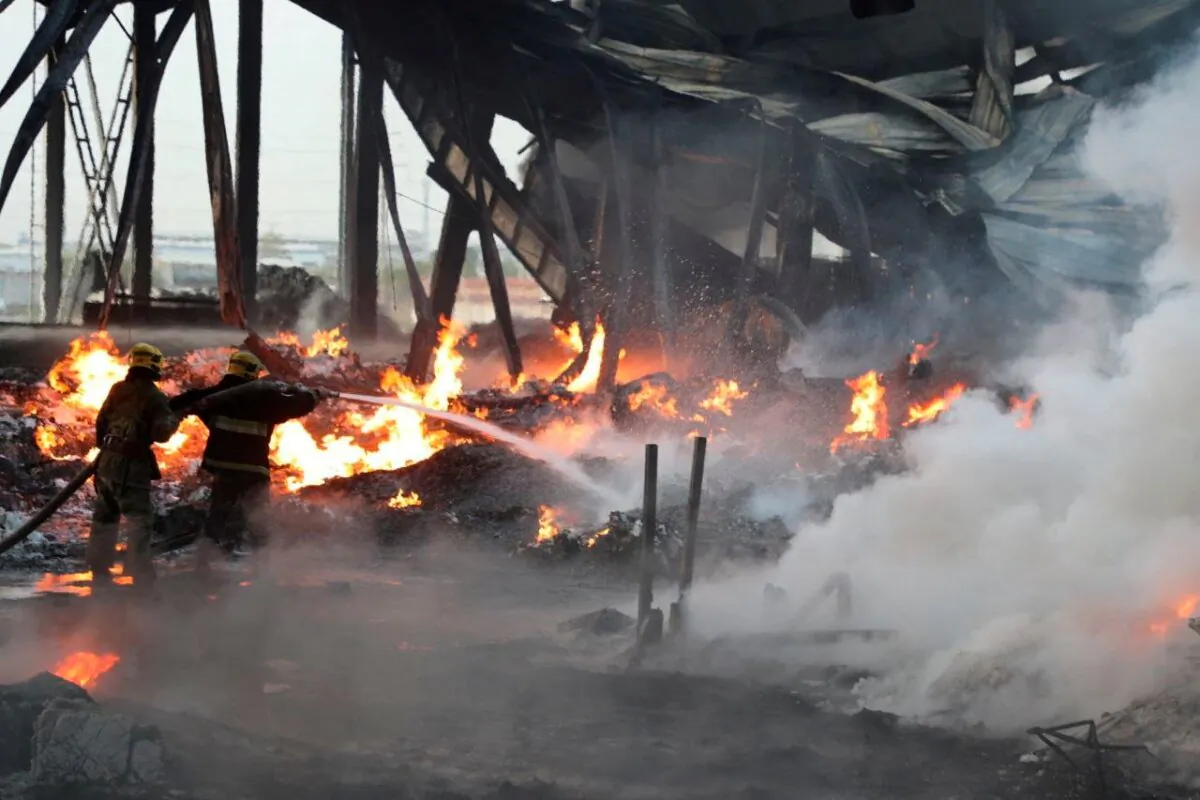 Specialists work to extinguish fire following an explosion at a warehouse near an airport in Tashkent, Uzbekistan, on Sept. 28, 2023. (Government of Uzbekistan/Handout via Reuters)
