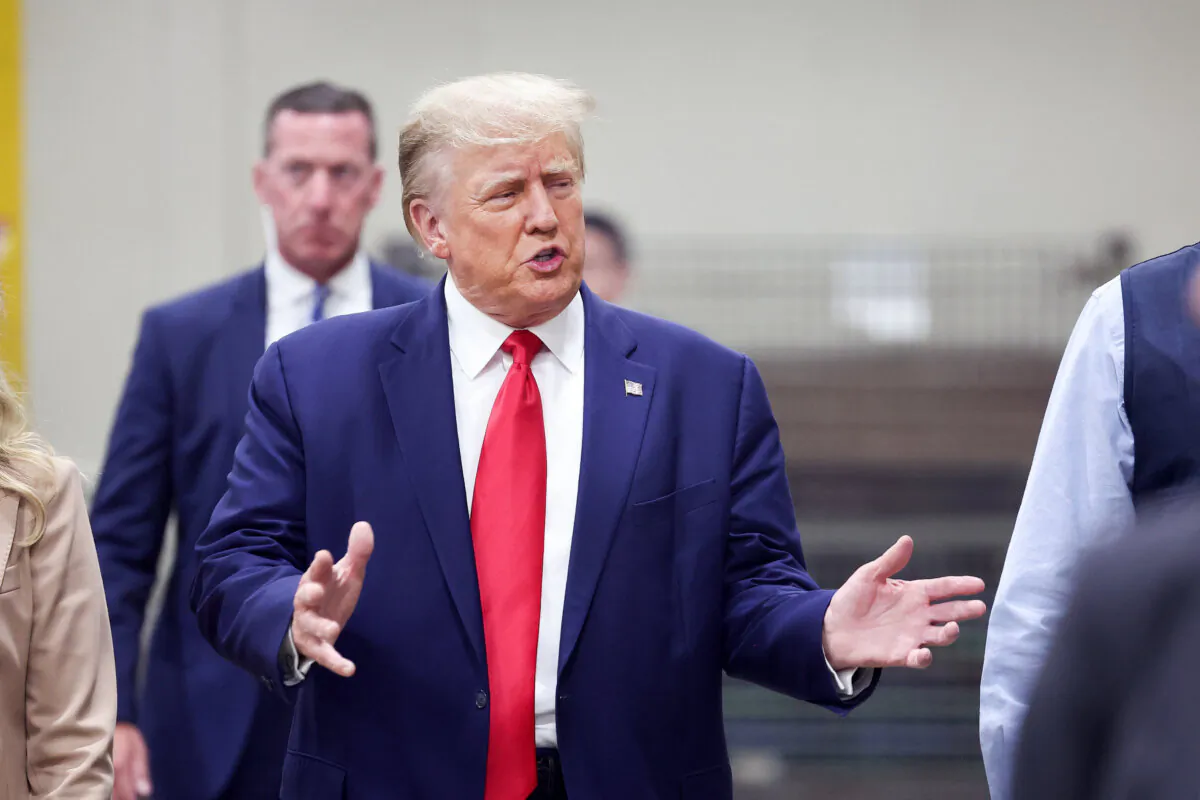 Donald Trump tours Drake Enterprises, an automotive parts manufacturer, before speaking to guest at a small rally in Clinton Township, Mich., on Sept. 27, 2023. (Photo by Scott Olson/Getty Images)