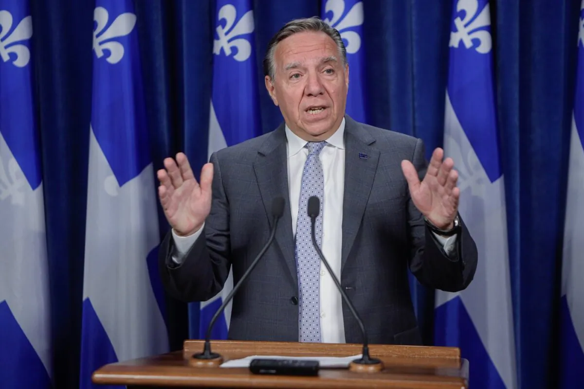 Premier François Legault gestures as he speaks to the media at the legislature in Quebec City on Aug. 23, 2023. (The Canadian Press/Francis Vachon)