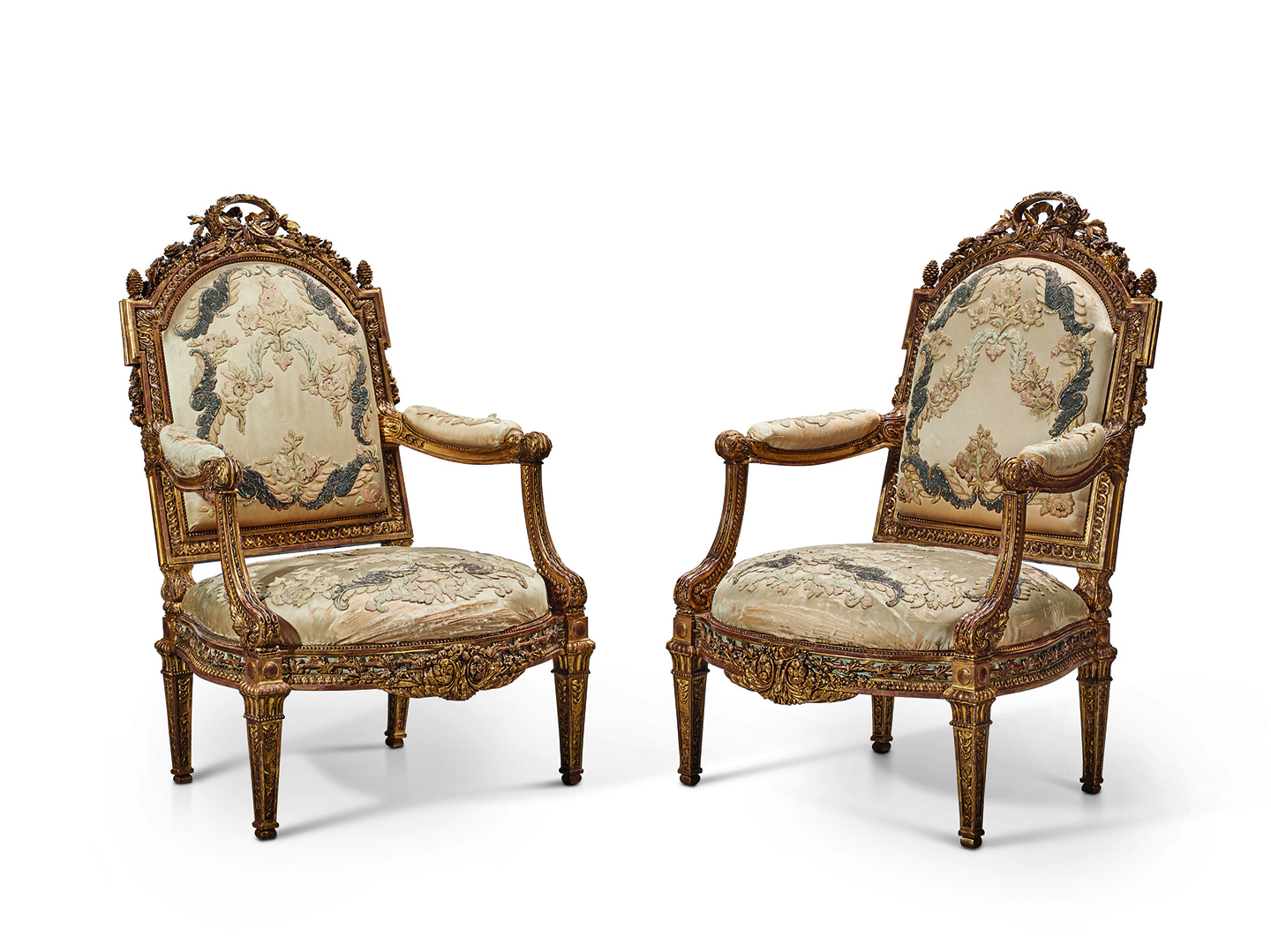 A Pair of Late Louis XV Giltwood and White-Painted Fauteuils 