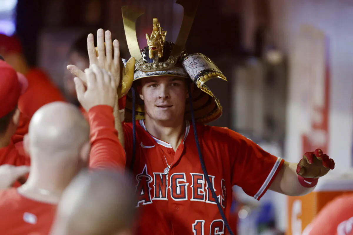 Mickey Moniak (16) of the Los Angeles Angels celebrates his second inning home run against the New York Mets with his teammates in the dugout at Citi Field in New York City on Aug. 26, 2023. (Jim McIsaac/Getty Images)