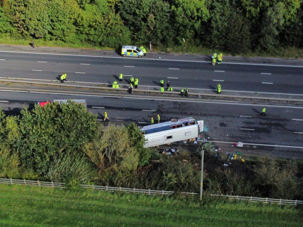 Emergency services at the scene of a coach crash on the M53 motorway, between junction 5 at Ellesmere Port and junction 4 at Bebbington in Hooton, England, on Sept. 29, 2023. (Peter Byrne/PA via AP)