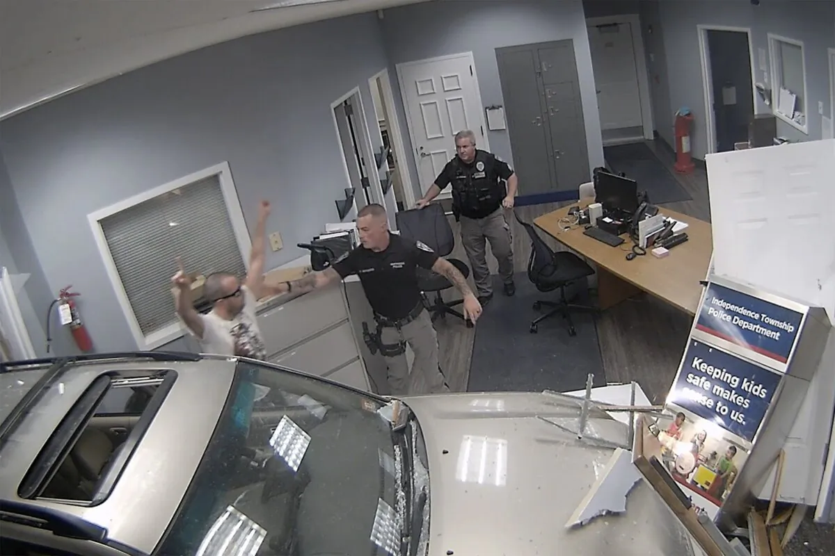 Police detain John Hargreaves, 34, after he drove his SUV through the police headquarters in Independence Township, N.J., on Sept. 20, 2023. (Warren County Prosecutor's Office via AP)