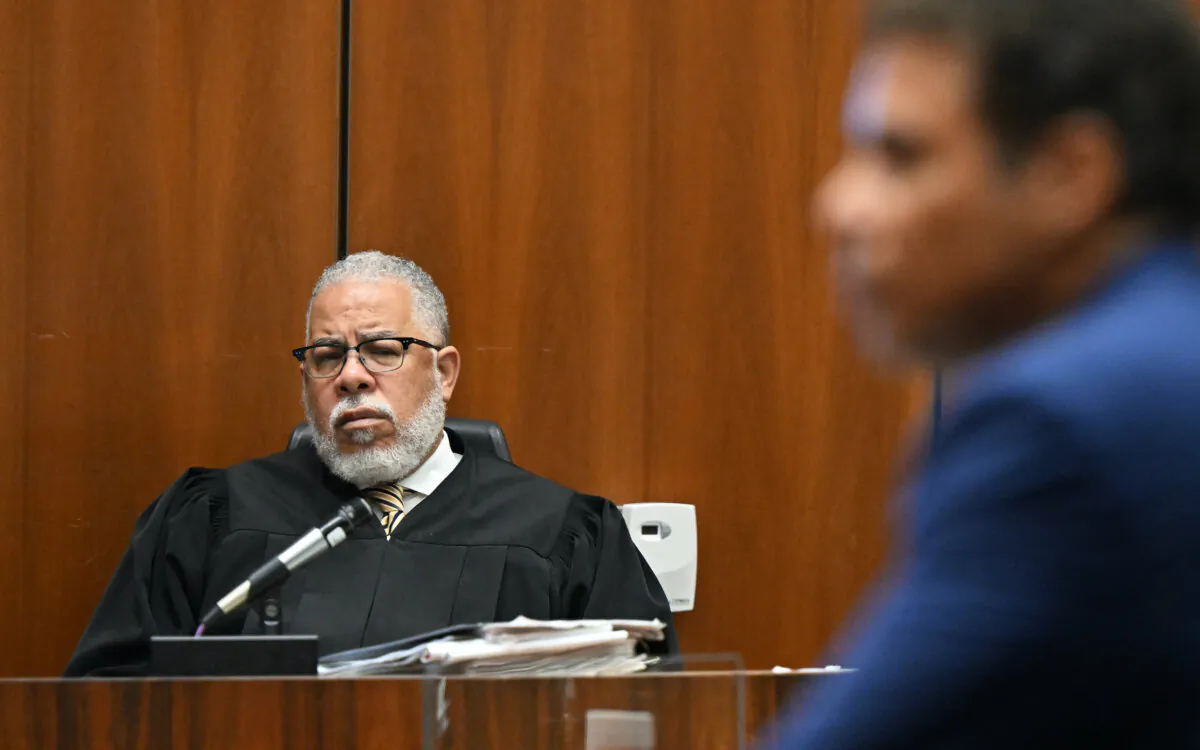 A judge listens as a public defender speaks to the jury during closing arguments in a trial in Los Angeles on June 30, 2022. (Frederic J. Brown-Pool/Getty Images)