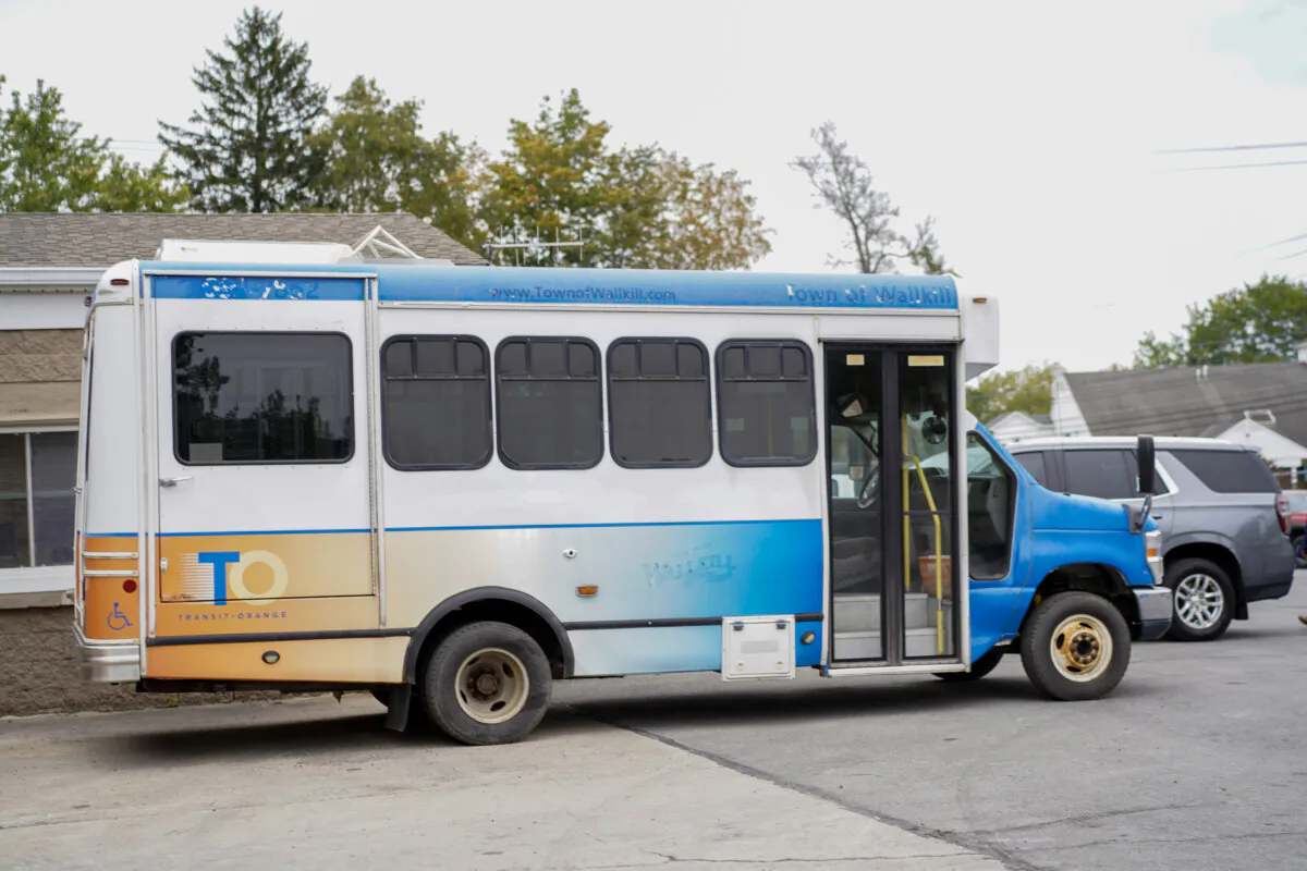 The shuttble bus donated by Town of Wallkill to the City of Middletown in front of the highway department garade in the Town of Walkill, N.Y., on Sept. 28, 2023. (Cara Ding/The Epoch Times)