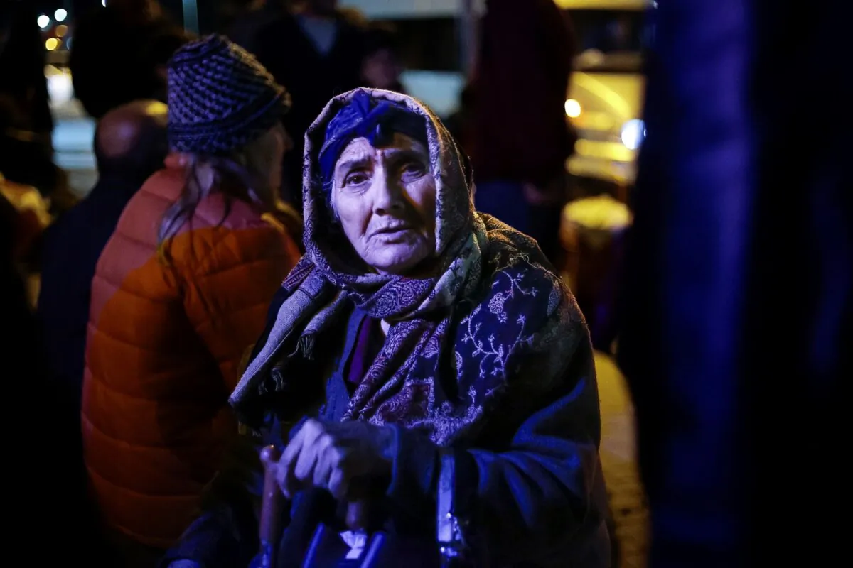 An ethnic Armenian woman from Nagorno-Karabakh stands near a tent camp after arriving to Armenia's Goris in Syunik region, Armenia, on Sept. 29, 2023. (Vasily Krestyaninov/AP Photo)