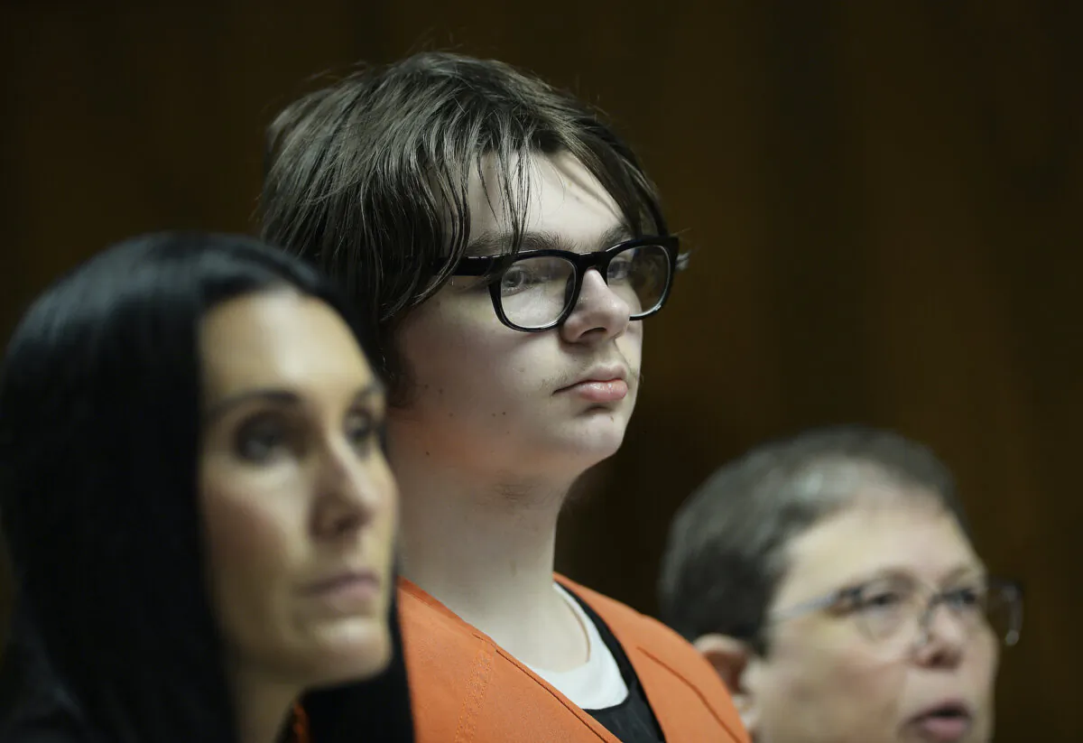 Ethan Crumbley stands with his attorneys, Paulette Loftin and Amy Hopp during his hearing at Oakland County Circuit Court in Pontiac, Mich. on Aug. 1, 2023. (Clarence Tabb Jr./Detroit News via AP, Pool)