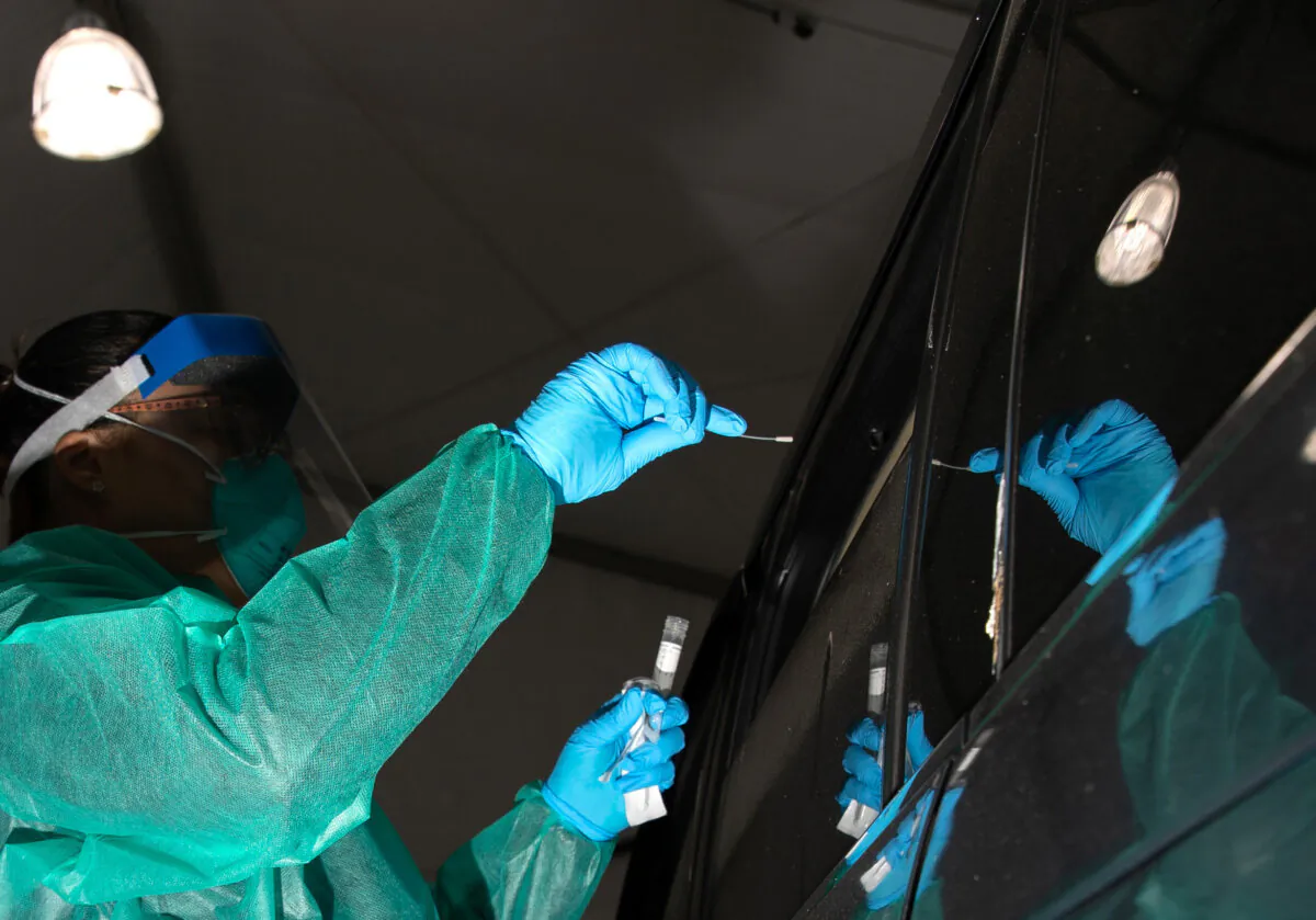 A doctor administers a COVID-19 test in New York in a March 28, 2020, file image. (John Moore/Getty Images)