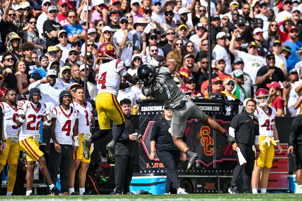 Cam'Ron Silmon-Craig (7) of the Colorado Buffaloes intercepts a pass intended for Mario Williams (4) of the USC Trojans in the third quarter at Folsom Field in Boulder, Colo., on Sept. 30, 2023. (Dustin Bradford/Getty Images)