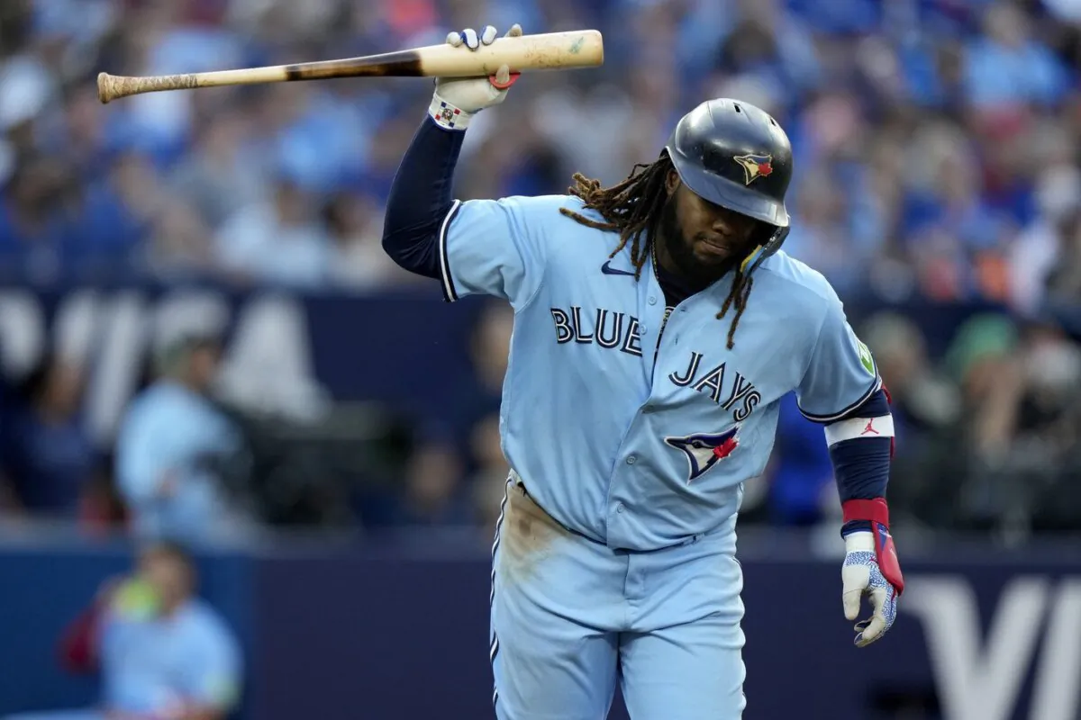 Toronto Blue Jays' Vladimir Guerrero Jr. (27) gestures with his bat after popping out during tenth inning against the Tampa Bay Rays, in Toronto on Sept. 30, 2023. (The Canadian Press/Frank Gunn)