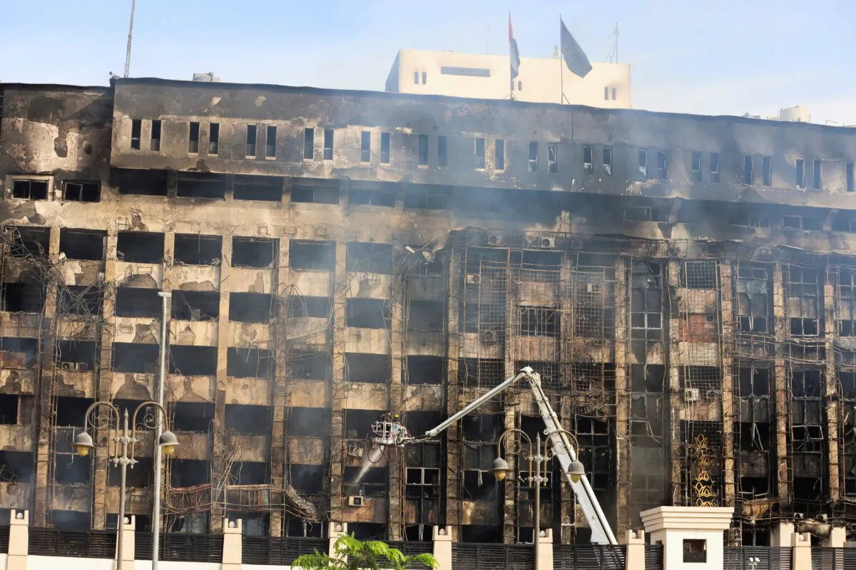 Efforts are made to douse a fire that broke out at a police facility, in Ismailia, Egypt, on Oct. 2, 2023. (Mohamed Abd El Ghany/Reuters)