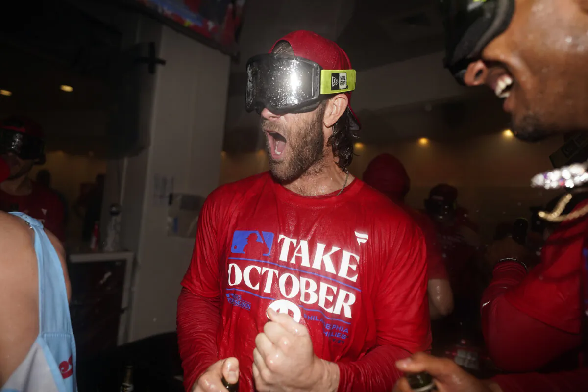 Philadelphia Phillies' Bryce Harper celebrates after winning a baseball game against the Pittsburgh Pirates to clinch a wild-card playoff spot in Philadelphia on Sept. 26, 2023. (Matt Slocum/AP Photo)