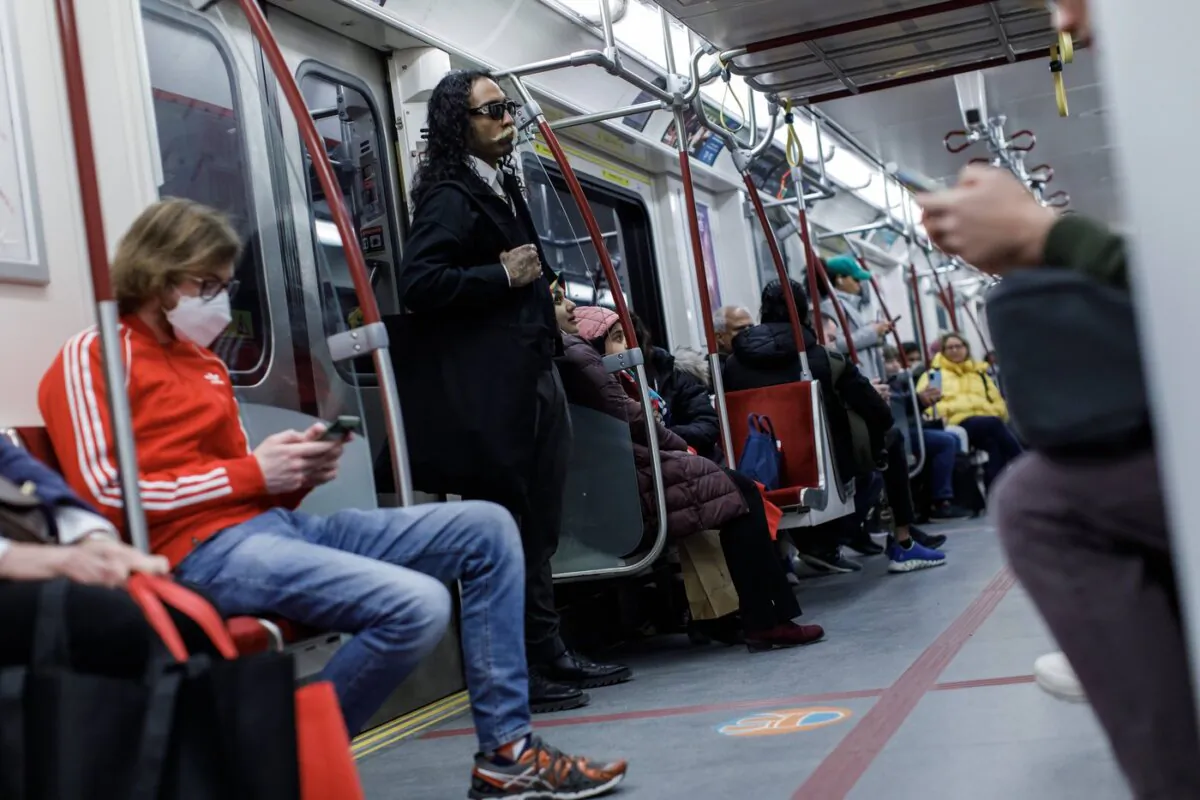 Riders take a subway train on the Toronto Transit Commission station in downtown Toronto, on April 1, 2023. (The Canadian Press/Cole Burston)