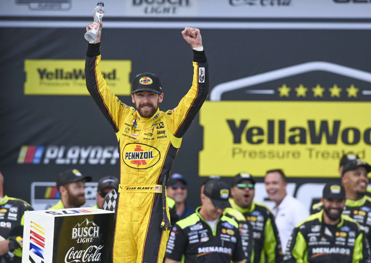 Ryan Blaney, front left, celebrates after winning a NASCAR Cup Series auto race at Talladega Superspeedway, in Talladega, Ala., on Oct. 1, 2023. (Julie Bennett/AP Photo)