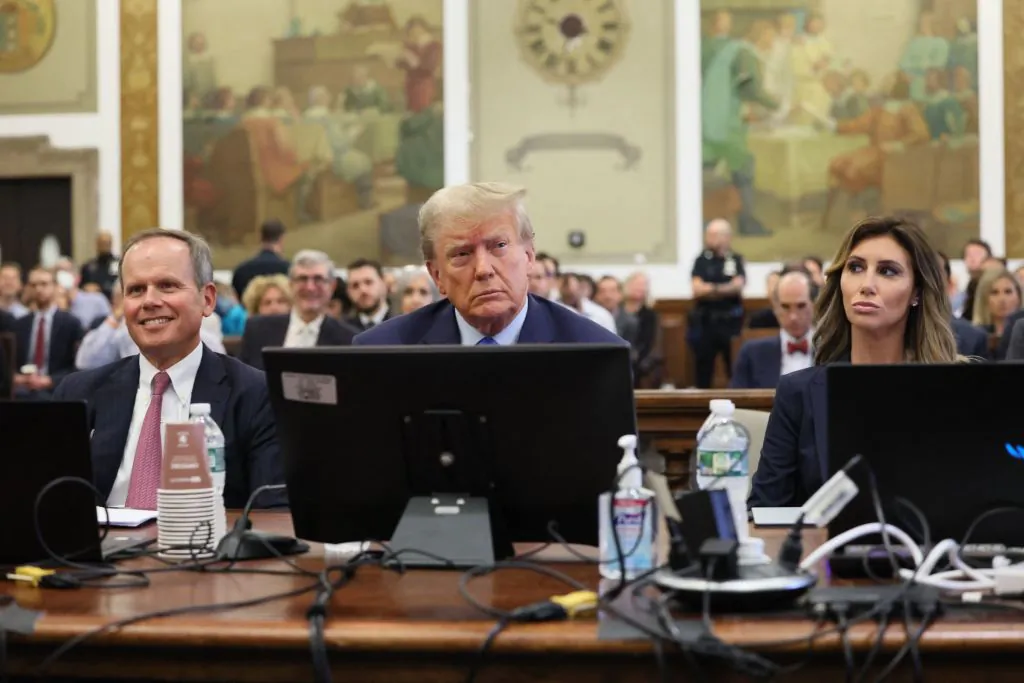 Former President Donald Trump (C) attends the trial of himself, his adult sons, the Trump Organization and others in a civil fraud case brought by state Attorney General Letitia James, at a Manhattan courthouse, in New York City, on Oct. 2, 2023. (Brendan McDermid/AFP via Getty Images)