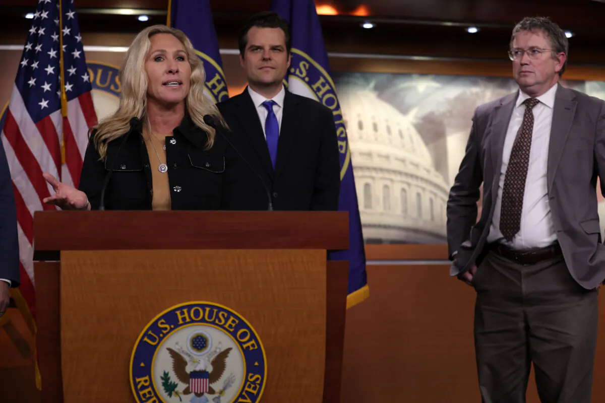 (L–R) Rep. Marjorie Taylor Greene (R-Ga.) speaks as Rep. Matt Gaetz (R-Fla.) and Rep. Thomas Massie (R-Ky.) listen during a news conference at the U.S. Capitol in Washington on Nov. 17, 2022. (Alex Wong/Getty Images)