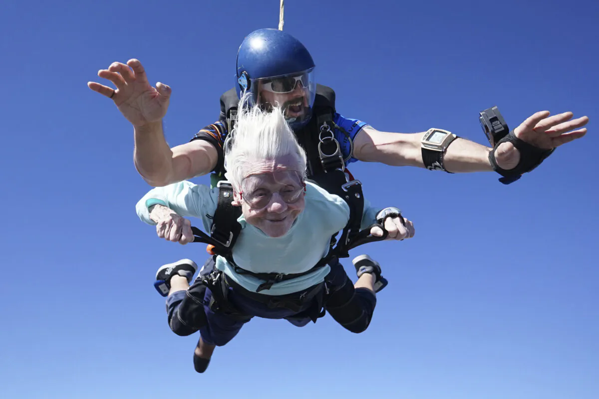 Dorothy Hoffner, 104, falls through the air with tandem jumper Derek Baxter as she becomes the oldest person in the world to skydive, at Skydive Chicago in Ottawa, Ill., on Oct. 1, 2023. (Daniel Wilsey via AP)