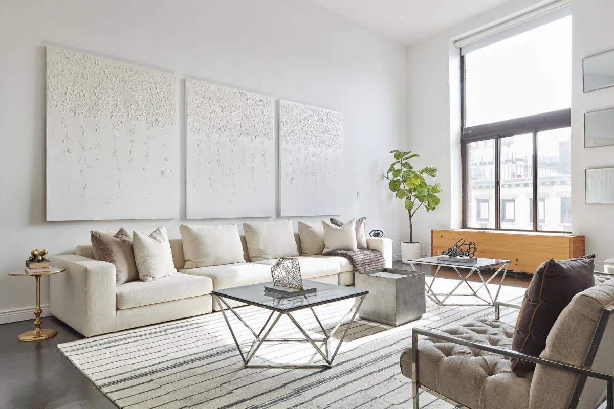 White-on-white artwork and white upholstery help make this living space feel modern and fresh. (Scott Gabriel Morris/TNS)
