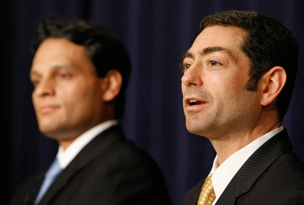 Dr. Felipe Lobelo of the Centers for Disease Control and Prevention (L) and Special Assistant to the President for Justice and Regulatory Policy Tino Cuellar (R) at a town hall meeting about the government's efforts to control the impact of the H1N1 virus, on May 8, 2009, in Washington. (Chip Somodevilla/Getty Images)