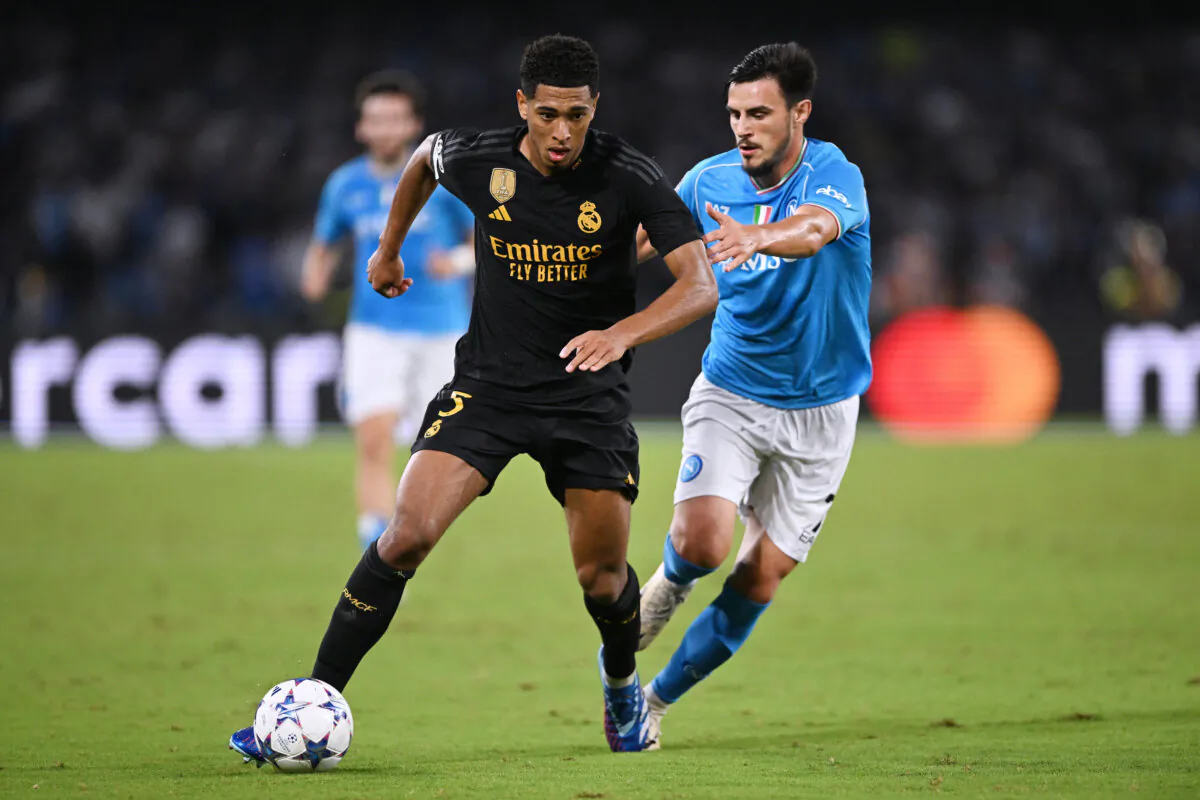 Jude Bellingham of Real Madrid controls the ball whilst under pressure from Eljif Elmas of Napoli during the UEFA Champions League match between SSC Napoli and Real Madrid CF at Stadio Diego Armando Maradona in Naples, Italy, on Oct. 03, 2023. (Francesco Pecoraro/Getty Images)