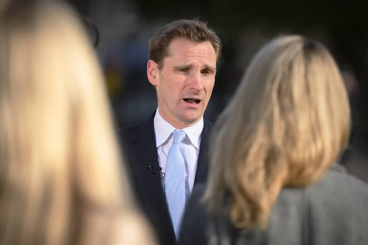 Chris Philp, minister of state for crime, policing and fire, is interviewed by a media team near to the Houses of Parliament in London on March 27, 2023. (Leon Neal/Getty Images)