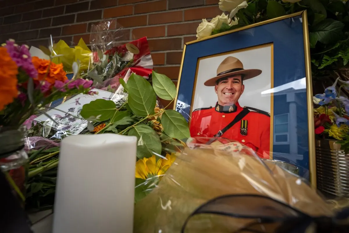 A memorial is set up for RCMP Const. Rick O’Brien, in front of the Ridge Meadows detachment in Maple Ridge, B.C., on Sept. 23, 2023. (The Canadian Press/Ethan Cairns)