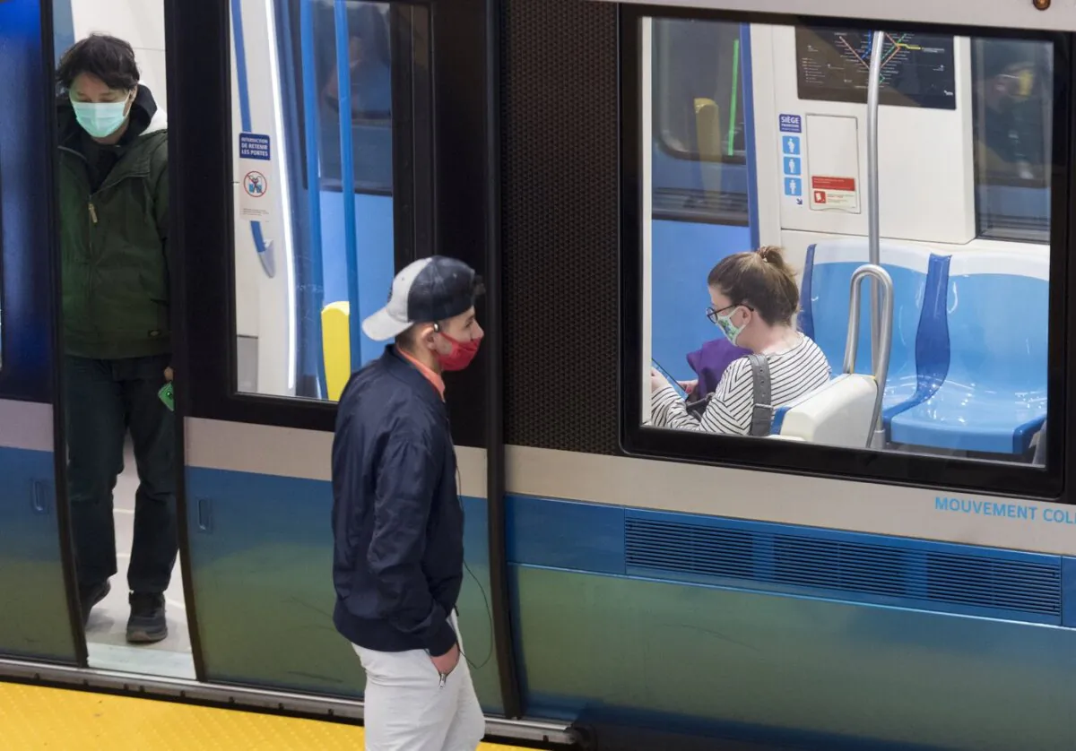 People wear face masks as they commute via metro in Montreal, on Oct. 17, 2020. (The Canadian Press/Graham Hughes)