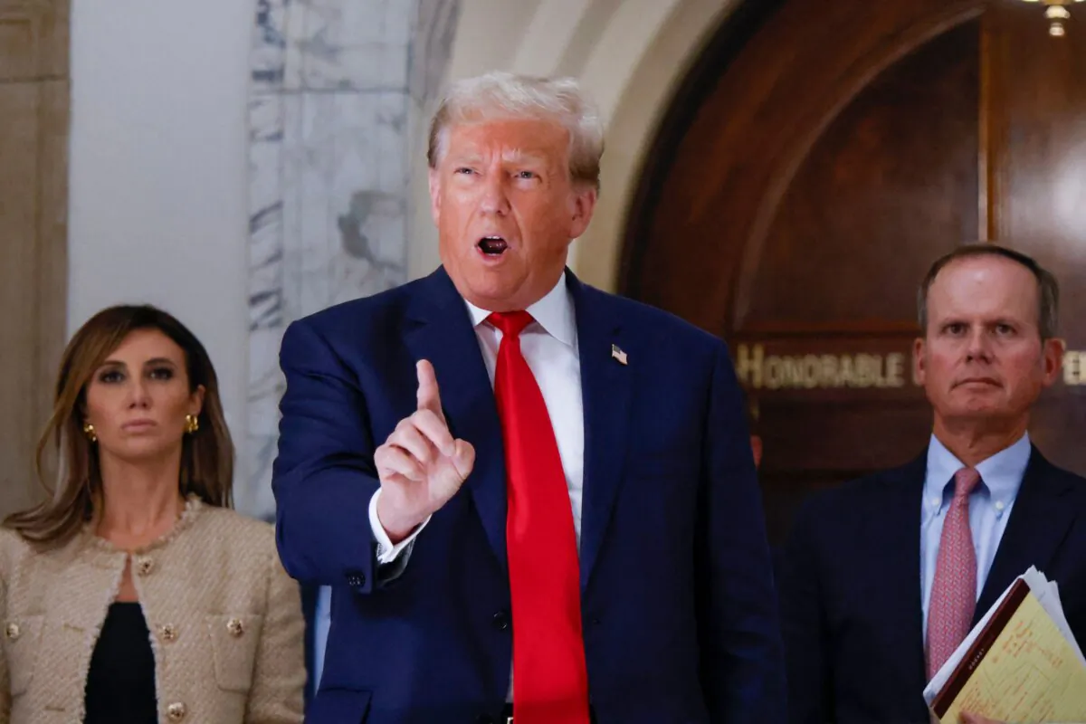Former President Donald Trump speaks to the media during the third day of his civil fraud trial in New York on Oct. 4, 2023. (Kena Betancur/AFP via Getty Images)