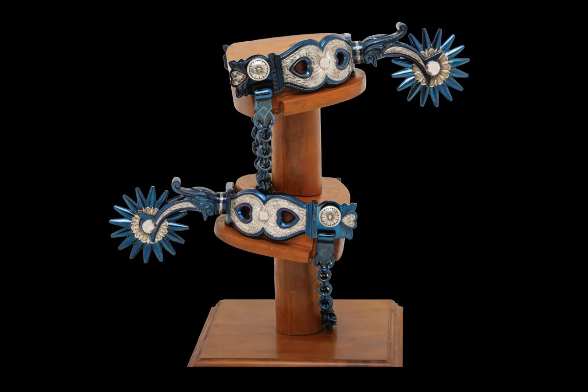"Heart Spurs," 2017, "Encore Piece," by bit and spur maker Ernie Marsh. Steel with engraved and inlaid fine silver. The flashes of blue on the spurs are nitre blue, a protective coating used to prevent rust. (National Cowboy & Western Heritage Museum)
