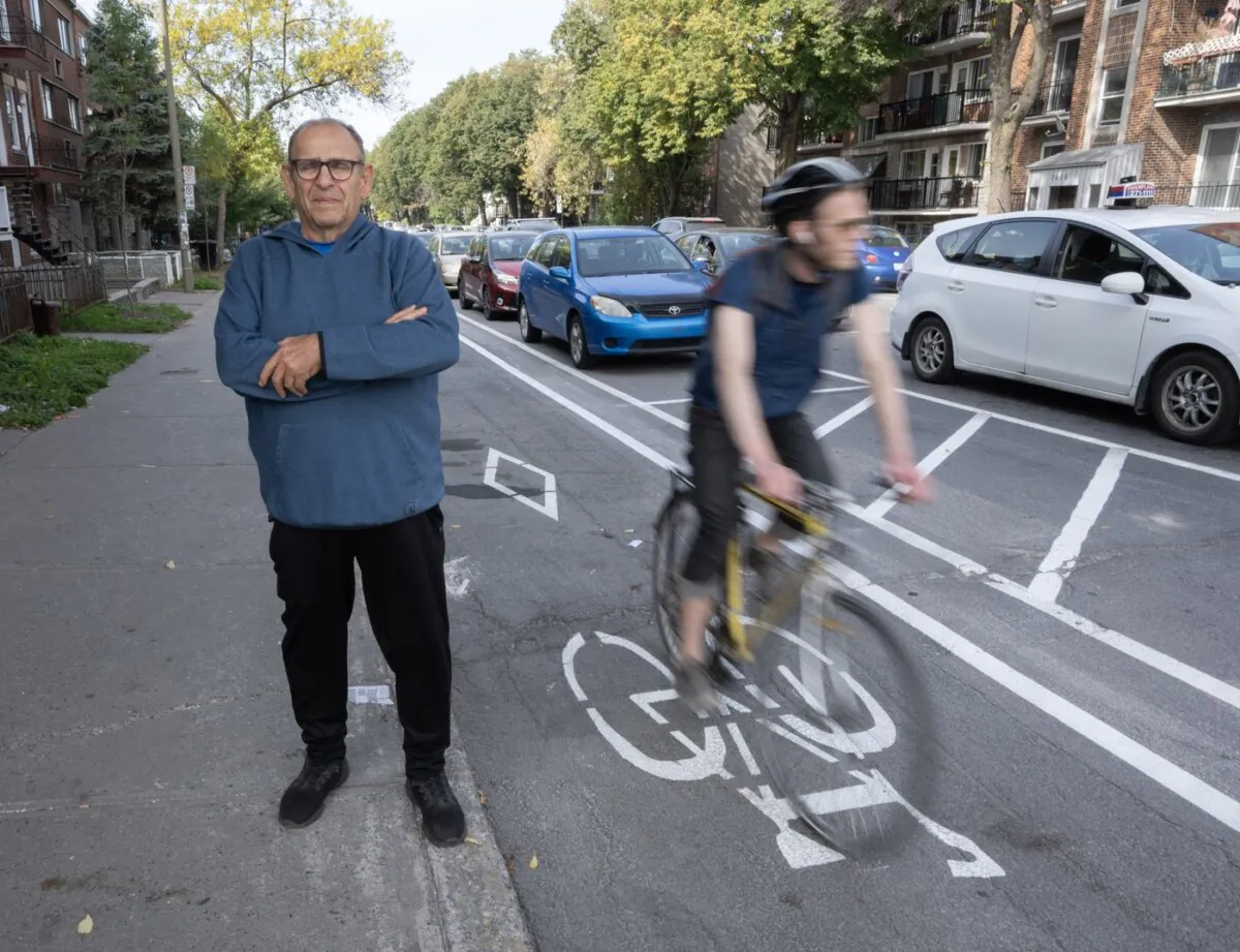 Mario di Chiaro stands next to the bike path he is fighting to have removed in the densely populated neighbourhood of Park Extension, in Montreal, on Sept. 29, 2023. (The Canadian Press/Ryan Remiorz)