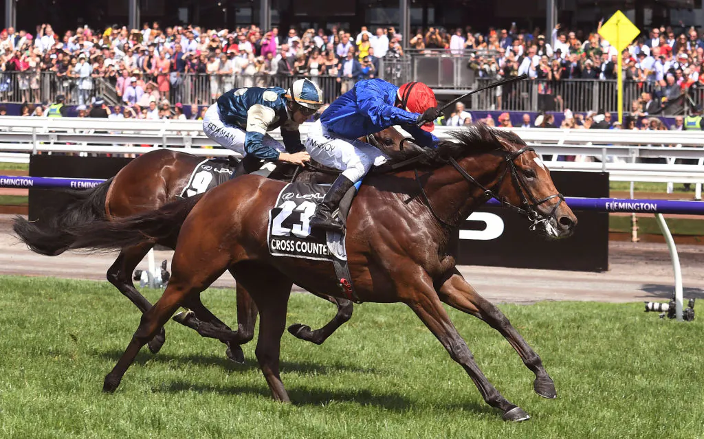 British horse Cross Counter (R) ridden by jockey Kerrin McEvoy wins the Melbourne Cup ahead of fellow British horse Marmelo in Melbourne, Australia, on Nov. 6, 2018. (William West/AFP via Getty Images)