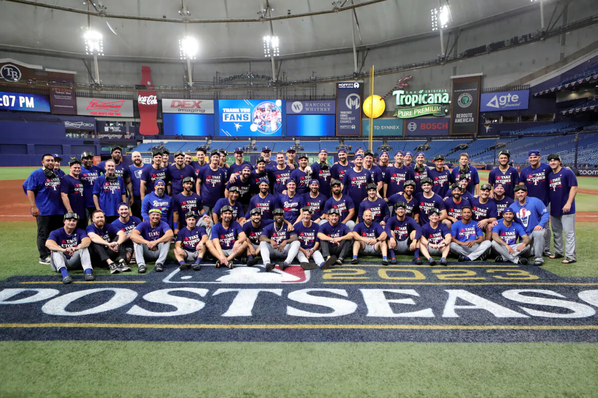 The Texas Rangers pose for a team photo after defeating the Tampa Bay Rays 7–1 in Game Two of the Wild Card Series at Tropicana Field in St Petersburg, Fla., on Oct. 4, 2012. (Megan Briggs/Getty Images)